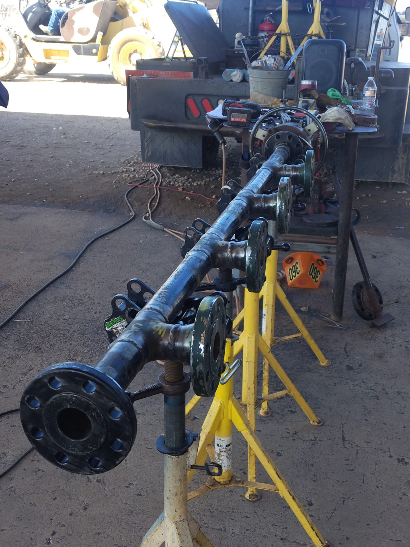 Completed pipe manifold with valves staged on pipe stands
